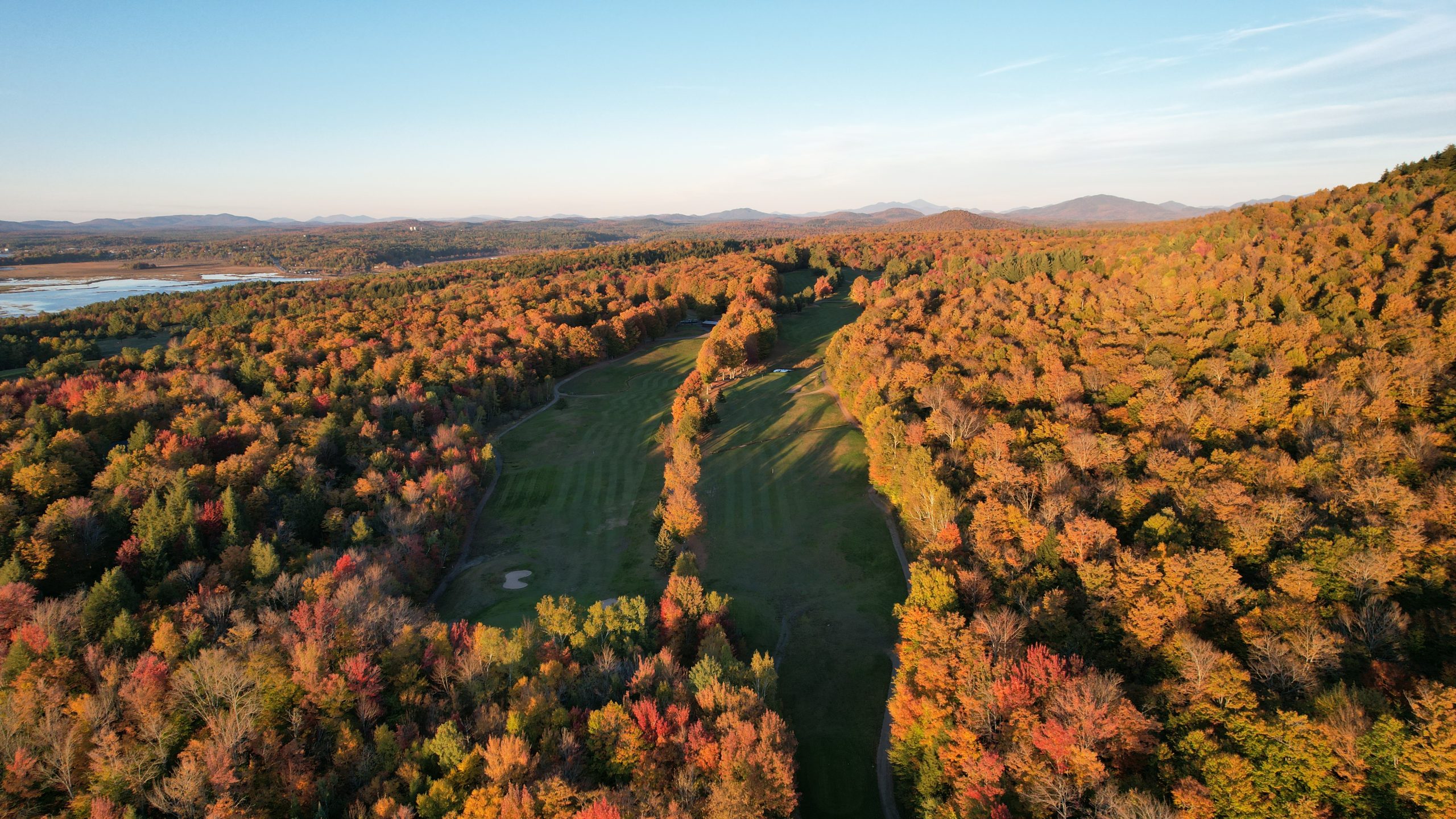 Drone shot of holes 1 and 2 with High Peaks in background